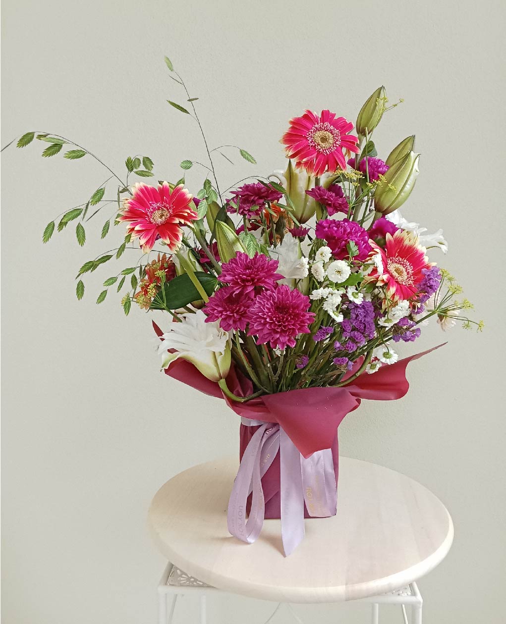 Floral Symphony bouquet with pink gerberas, white lilies, and purple chrysanthemums. Phuket flowers, perfect for special moments.