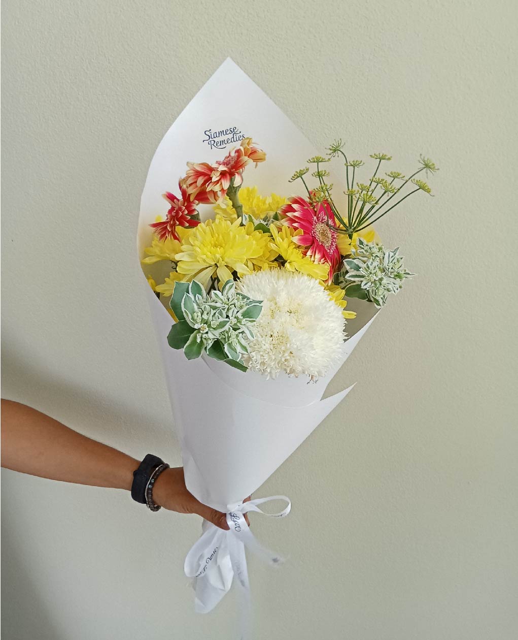 A vibrant 'Summer Breeze' bouquet with yellow gerberas, white spider mums, and dusty millers. Perfect flowers in Phuket for brightening any space.